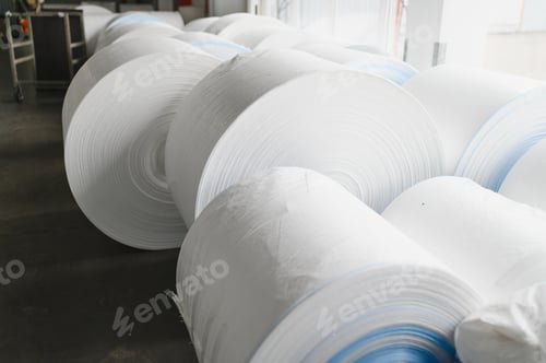 Preview: Polypropylene fabric rolls storing in factory warehouse