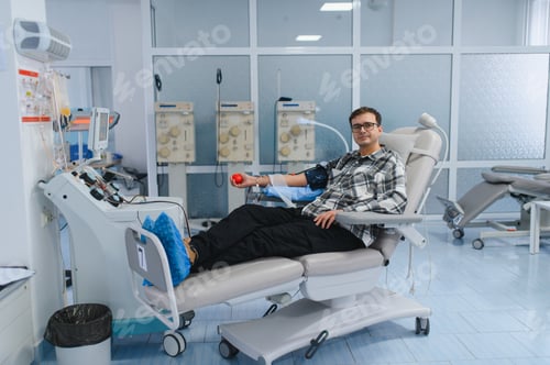 Preview: Man donating blood in modern medical center