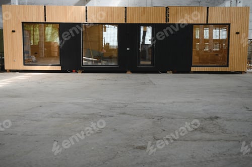 Preview: A new wooden modular prefabricated house inside in manufacturing facility