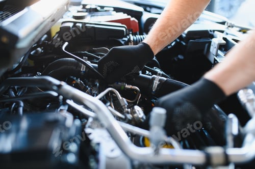 Preview: Mechanic hands repairing car engine for maintenance service