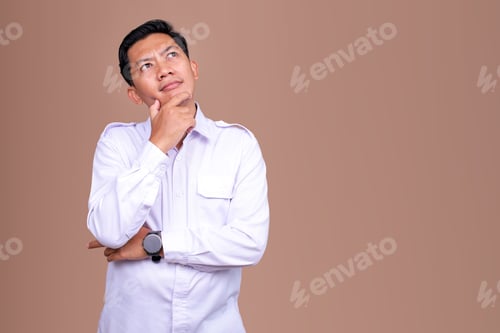 Preview: Asian Man in Formal White Work Attire Posing in Thinking Gesture