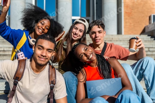 Preview: Diverse students smiling while sitting on university campus stairs