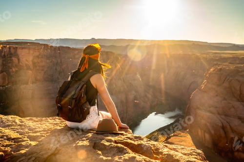 Preview: Woman enjoying sunset view at horseshoe bend canyon