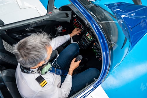 Preview: Experienced pilot preparing for solo flight in cockpit