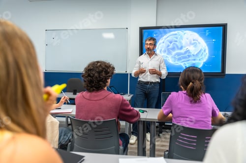 Preview: Teacher presenting brain neurology to students in classroom