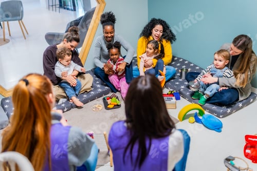 Preview: Diverse group of mothers and children creating music in daycare
