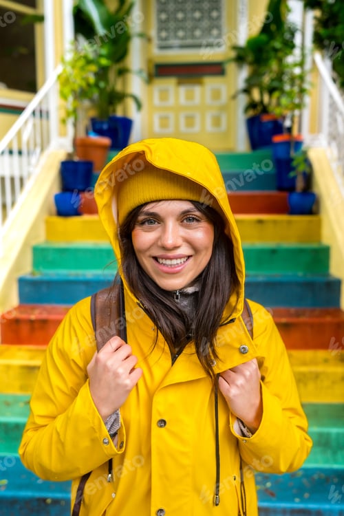 Preview: Smiling woman visiting san francisco with colorful stairs