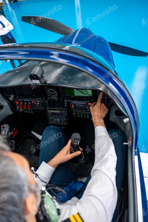 Preview: Pilot operating joystick and instrument panel in airplane cockpit