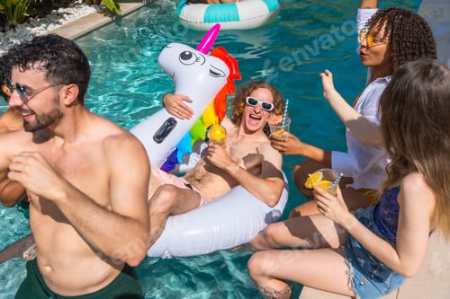 Preview: Group of friends enjoying fun summer pool party