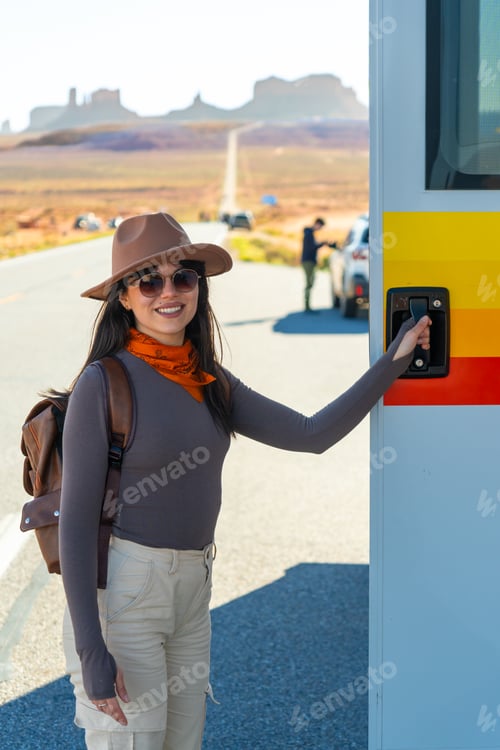 Preview: Woman opening camper van door at forrest gump point