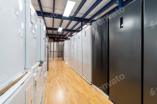 Preview: Refrigerators lining showroom floor in large appliance store