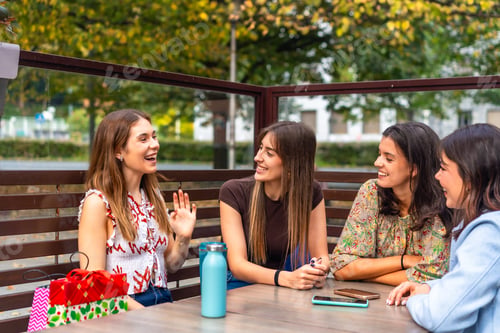 Preview: Girls friends laughing having fun outdoors chatting after shopping