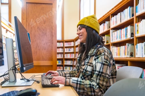 Preview: Young woman studying, learning and researching in san francisco library