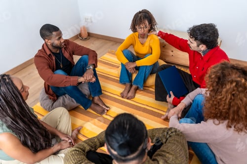 Preview: Diverse people sharing feelings in group therapy session