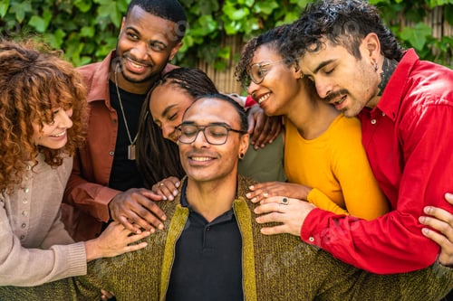 Preview: Diverse friends connecting, offering support and encouragement outdoors