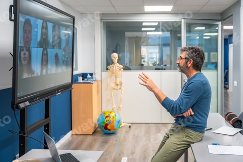 Preview: Male teacher conducting online anatomy class using video conference