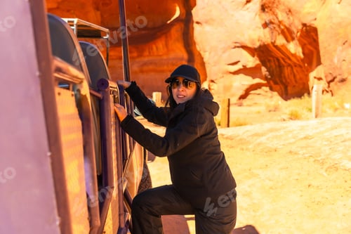 Preview: Woman embarking on navajo jeep tour in monument valley