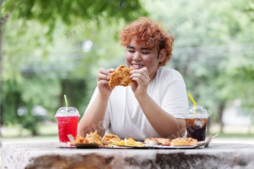 Preview: Happy Gen Z Teen Eating Fried Chicken Outdoors – Junk Food Lifestyle, Fast Food and Unhealthy Eating