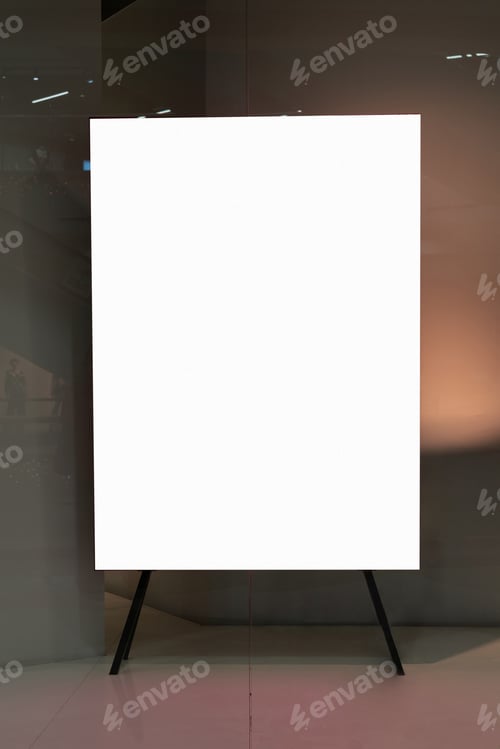 Preview: Blank canvas on easel in well-lit gallery setting