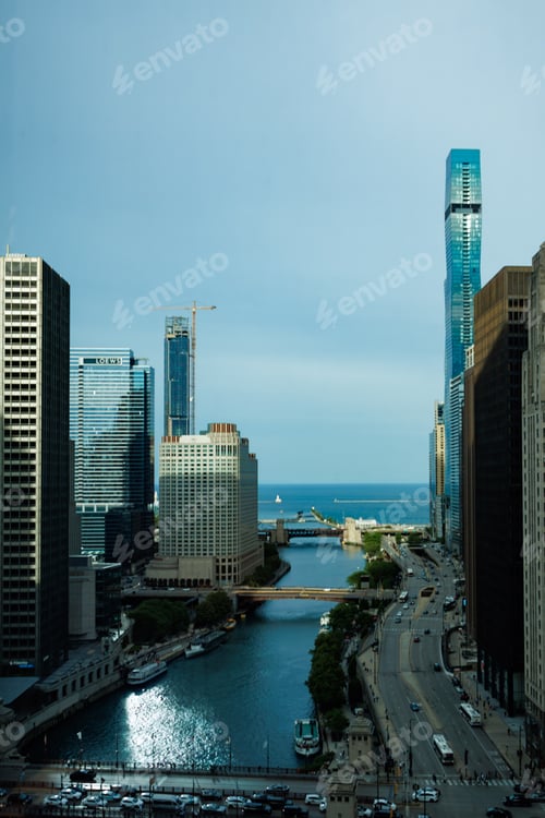 Preview: View of Chicago skyline showing buildings, river, and Lake Michigan on a clear day with traffic and