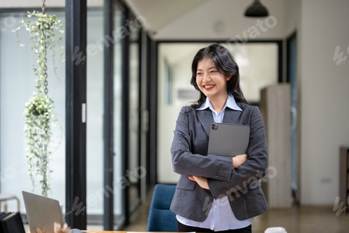 Preview: Confident Businesswoman Smiling While Standing in Modern Office Space