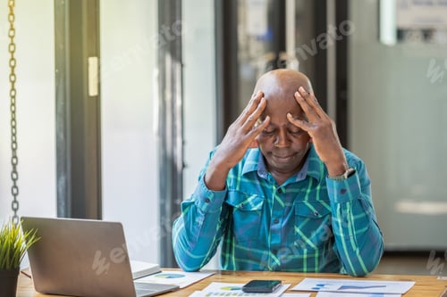 Preview: Man in Office Showing Signs of Stress and Anxiety While Working