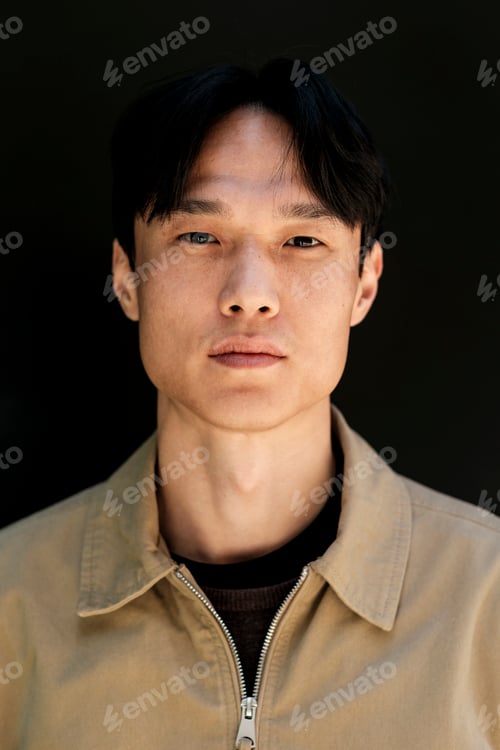 Preview: Young asian man portrait looking at camera