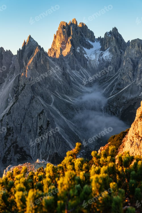Preview: Alpine landscape of sunrise over Cadini di Misurina with rugged mountain range during autumn in Dolo