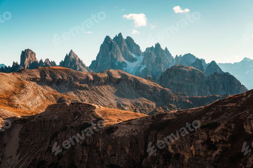 Preview: Dramatic Dolomites Mountain Landscape with Jagged Rocky Peaks Under Clear Blue Sky Italy
