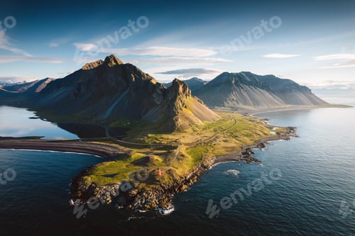 Preview: Aerial View of Eystrahorn mountain by coastal peninsula during golden hour in East Iceland