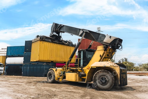 Preview: Loaded container handler forklift moving cargo container in crowded shipping yard at port terminal