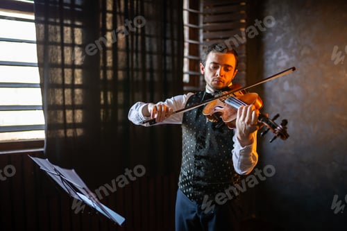 Preview: Expressive violinist performing indoors near a window
