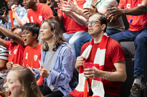 Preview: Red team football supporters showing mixed reactions in stadium stands