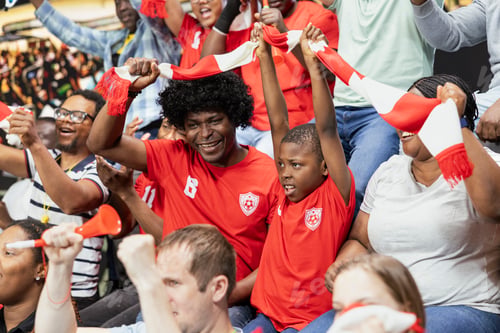 Preview: Happy parents bringing their kid fan to lively soccer match