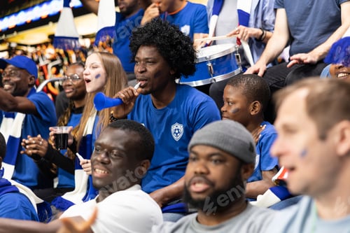 Preview: Black father with vuvuzela spending quality time with son at soccer stadium