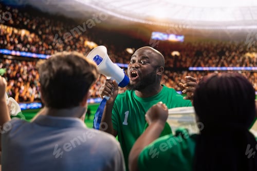 Preview: Close up of intense football supporter using megaphone to lead stadium crowd