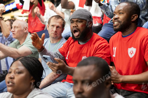 Preview: Diverse soccer fans following in-play live odds on phone betting app