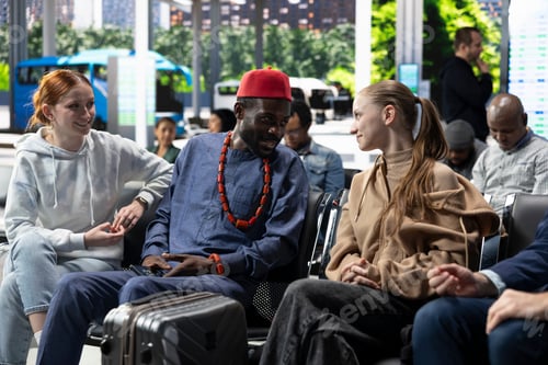Preview: Diverse group of friends waiting at bus stop for low fare interstate journey
