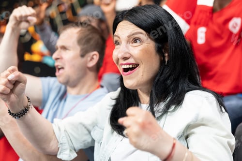 Preview: Ecstatic woman supporter celebrating big win during crucial football match