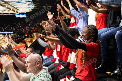 Preview: Excited sports crowd celebrating victory during football match