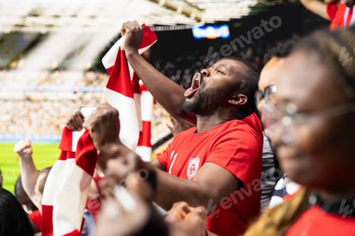 Preview: Joyful black man shouting and cheering after the winner goal
