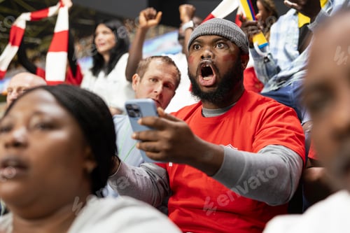 Preview: Black football fan in shock after winning jackpot live bet during soccer match