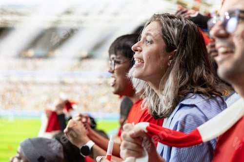 Preview: Excited woman football supporter shouting from stadium stands