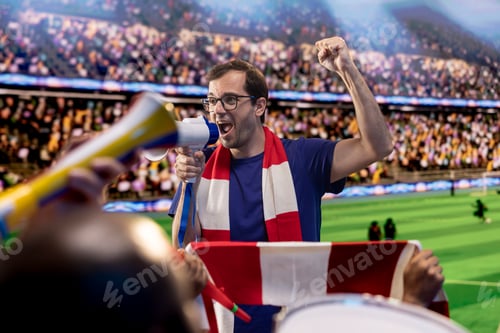 Preview: Man yells in megaphone during intense soccer match on stadium