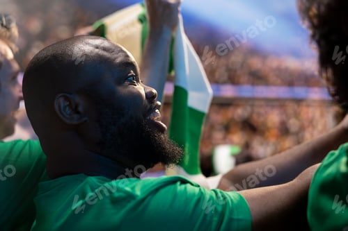 Preview: Close up of happy soccer supporter in stadium stands enjoying game