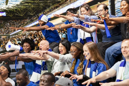 Preview: Diverse blue football supporters raising arms and chanting together