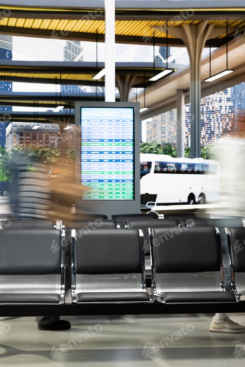 Preview: Long exposure image of commuters walking through crowded bus station