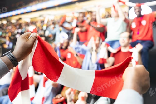 Preview: Energetic fan leader leading chanting fans with red team scarf