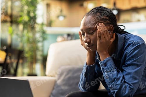 Preview: Headache on black woman working from home and feeling overwhelmed