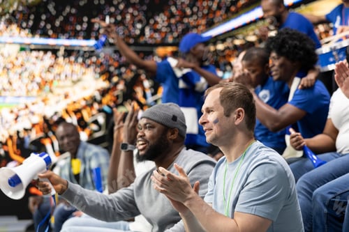 Preview: Blue soccer supporters cheering together in stadium during live football match